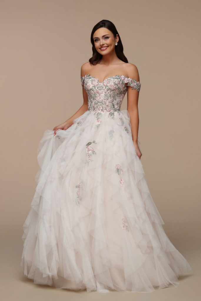Bride wearing a floral embroidered designer bridal gown from a bridal boutique where modern brides shop bridal for whimsical designer bridal gowns.