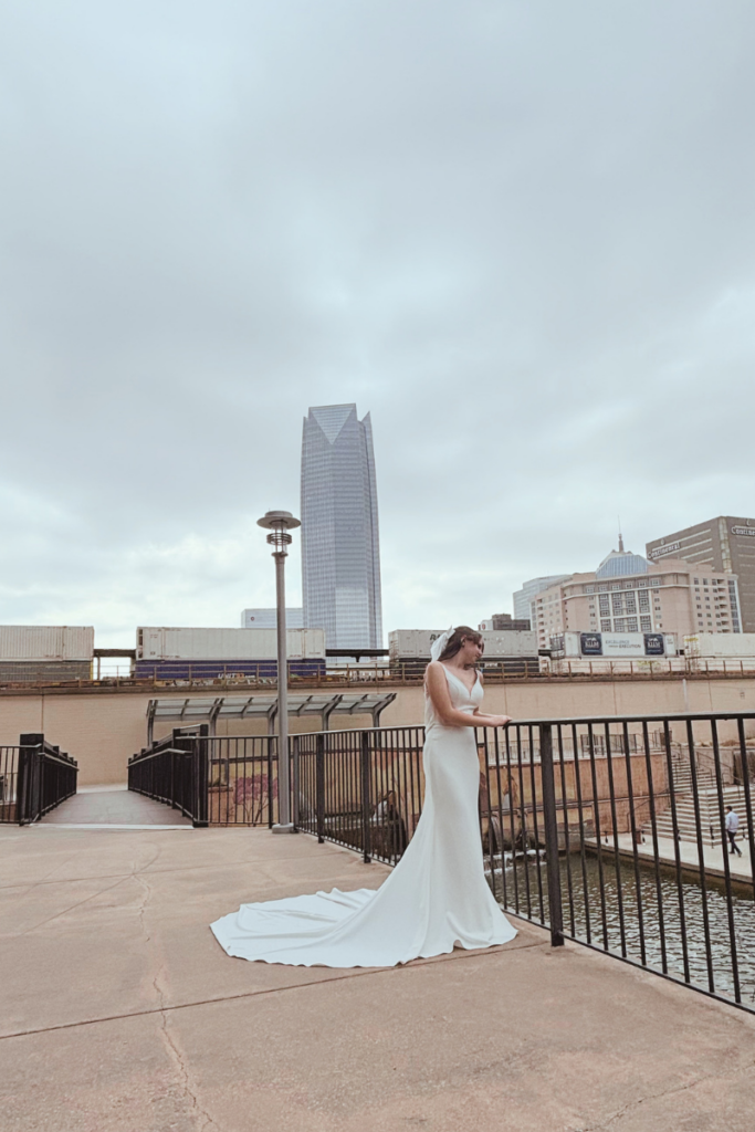 Bride wearing a modern wedding gown in downtown Oklahoma City for bridal tips and wedding dress advice.
