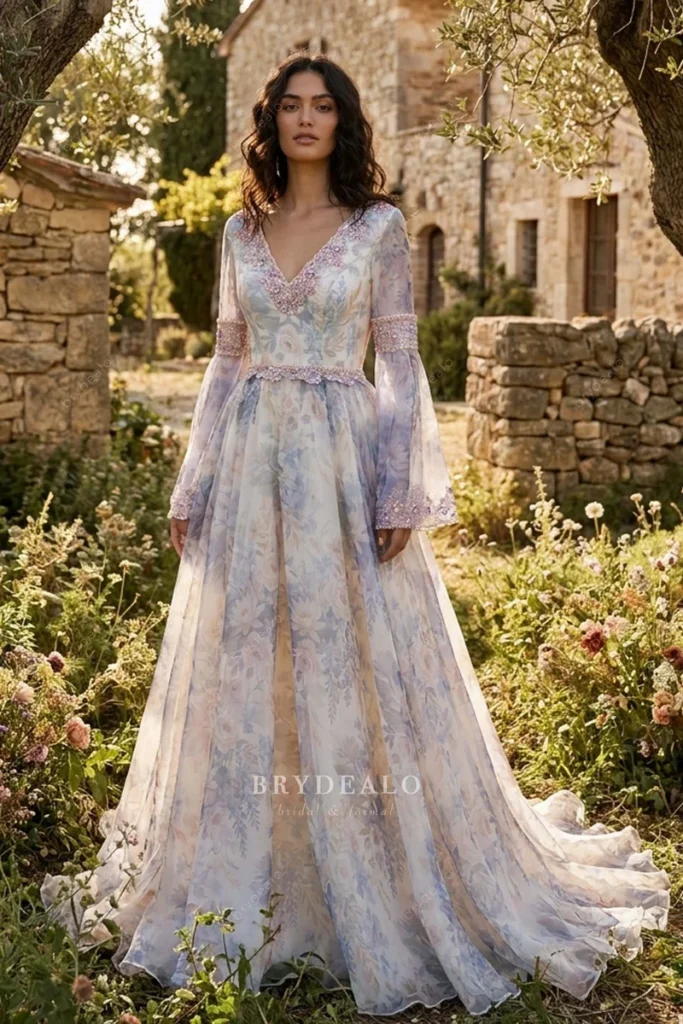 Purple floral alternative wedding dress with long sleeves and a flowing skirt reflecting colorful 2027 Bridal Trends.