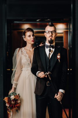 Stylish wedding couple in the interior. Glamorous bride and groom.