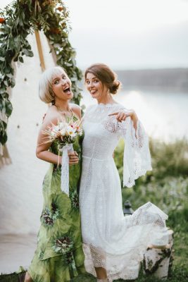 two-women-pose-in-outdoor-wedding-celebration-2026-09-22-16-21-15-utc